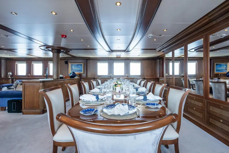 The Langley Yacht Photos Pics Luxurious dining area on 2009 Aegean Yacht 3 Mast Schooner, featuring elegant table settings.