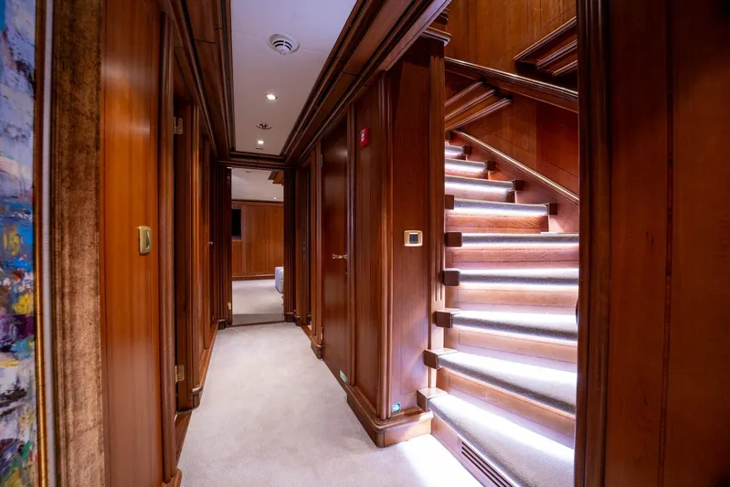 The Langley Yacht Photos Pics Luxurious wooden interior of 2009 Aegean Yacht 3 Mast Schooner, featuring illuminated staircase.