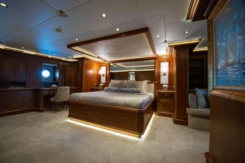 The Langley Yacht Photos Pics Luxurious bedroom interior on 2009 Aegean Yacht 3 Mast Schooner, featuring elegant wood finishes.