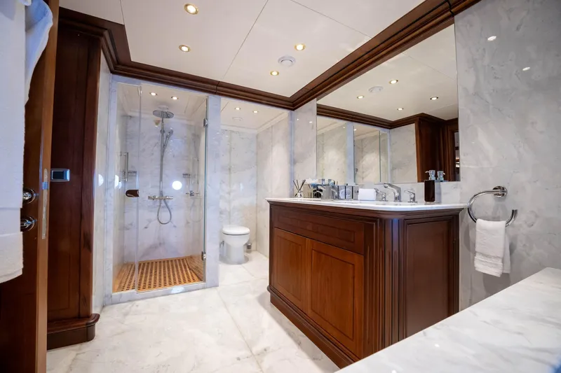 The Langley Yacht Photos Pics Luxurious yacht bathroom with marble finishes, wooden cabinetry, and glass shower enclosure. Aegean Yacht 3 Mast Schooner 2009.