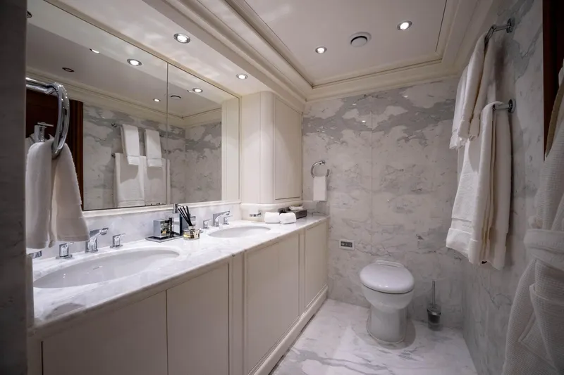 The Langley Yacht Photos Pics Luxurious marble bathroom on 2009 Aegean Yacht 3 Mast Schooner, featuring double sinks and elegant fixtures.