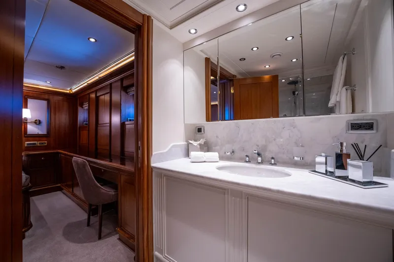 The Langley Yacht Photos Pics Luxurious bathroom interior on 2009 Aegean Yacht 3 Mast Schooner, featuring elegant wood and marble finishes.