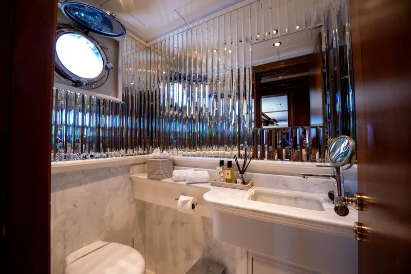 The Langley Yacht Photos Pics Luxurious bathroom on 2009 Aegean Yacht 3 Mast Schooner with elegant fixtures and porthole window.