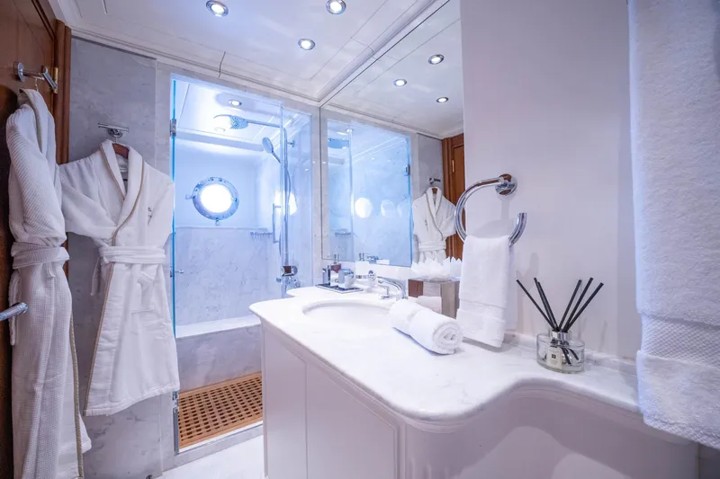 The Langley Yacht Photos Pics Luxurious bathroom on 2009 Aegean Yacht 3 Mast Schooner with marble finishes and elegant amenities.