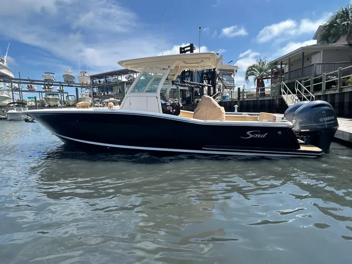  Yacht Photos Pics 2018 Scout 275 LXF boat docked at marina under clear blue sky.