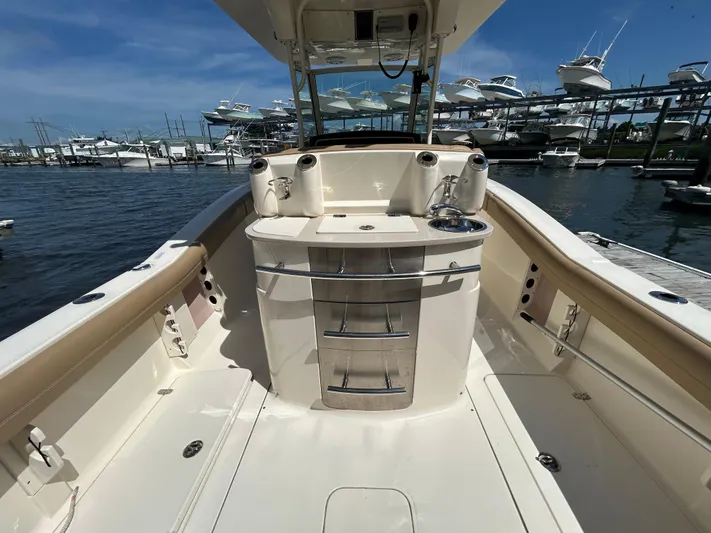  Yacht Photos Pics 2018 Scout 275 LXF boat interior with sink and storage, docked at marina.