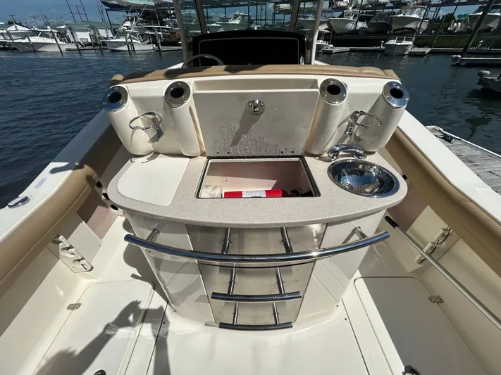 Yacht Photos Pics 2018 Scout 275 LXF boat interior with sink and storage at marina.