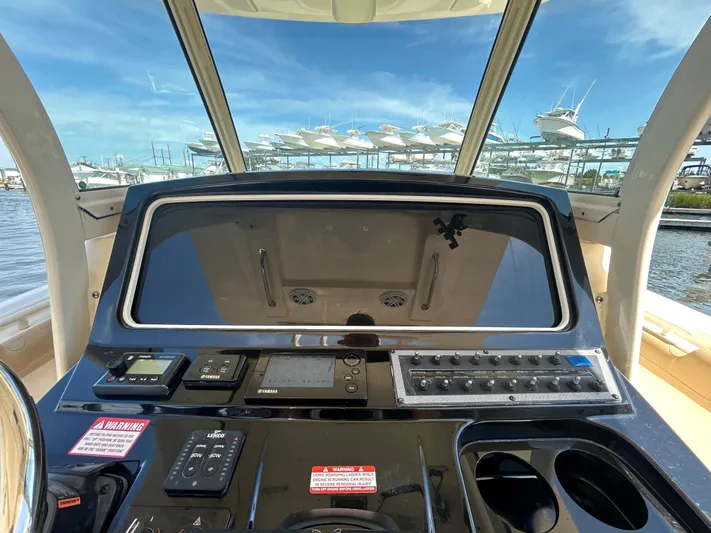  Yacht Photos Pics 2018 Scout 275 LXF boat dashboard with controls and navigation equipment.