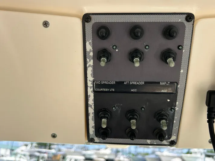  Yacht Photos Pics Control panel of a 2018 Scout 275 LXF boat with labeled switches.