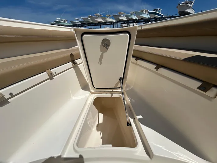  Yacht Photos Pics 2018 Scout 275 LXF boat storage compartment open under clear blue sky.