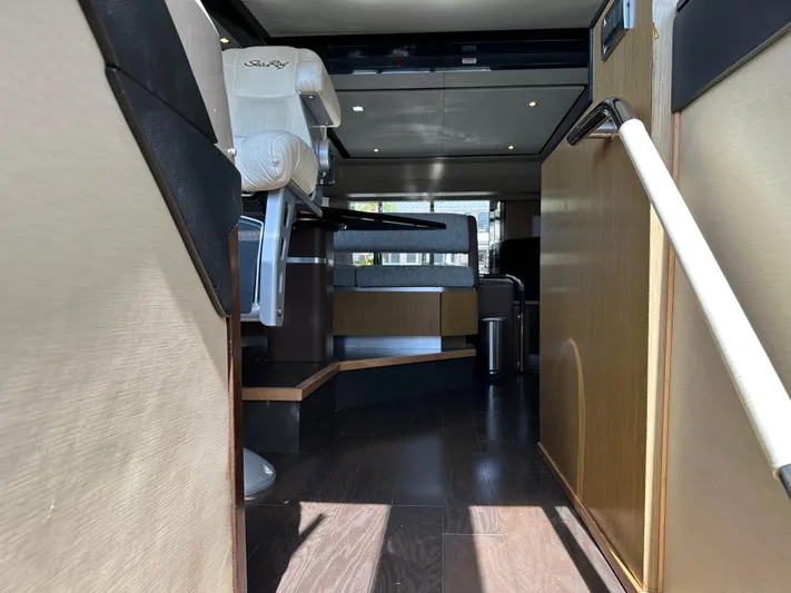  Yacht Photos Pics Interior view of 2016 Sea Ray L590 yacht, featuring luxurious seating and modern design.