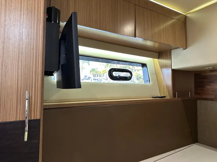  Yacht Photos Pics 2016 Sea Ray L590 interior with mounted TV and window view.