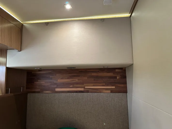  Yacht Photos Pics Interior of 2016 Sea Ray L590 yacht with wood paneling and modern lighting.