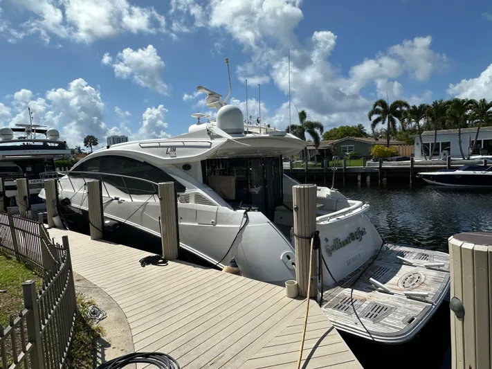  Yacht Photos Pics 2016 Sea Ray L590 yacht docked at marina under a clear blue sky.