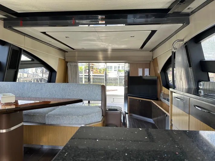  Yacht Photos Pics Luxurious interior of 2016 Sea Ray L590 yacht with modern furnishings and sleek design.