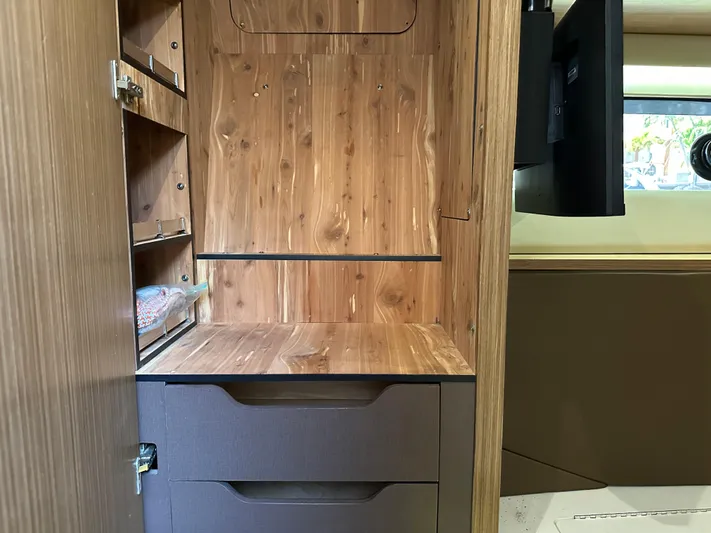  Yacht Photos Pics Interior of 2016 Sea Ray L590 yacht with wooden cabinetry and storage shelves.