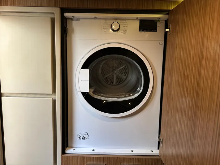  Yacht Photos Pics Blomberg dryer installed in 2016 Sea Ray L590 yacht's wooden cabinet.