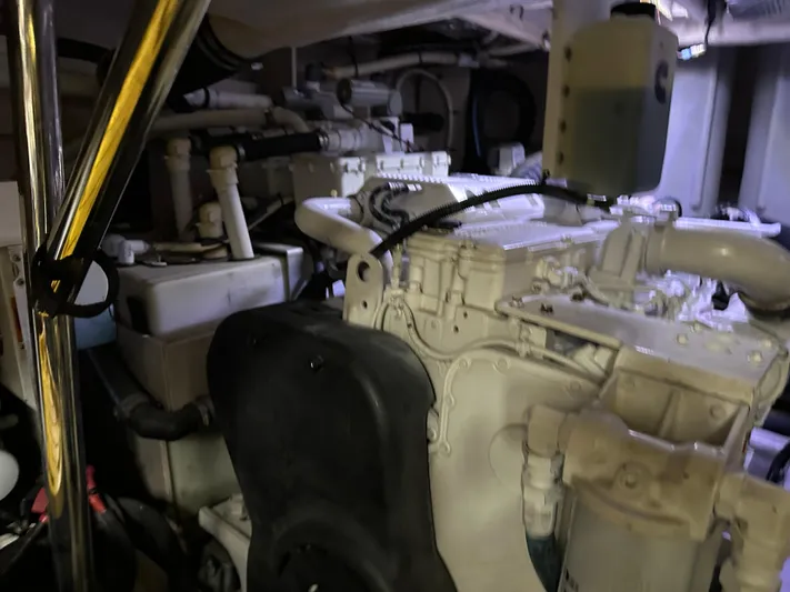  Yacht Photos Pics Engine room of a 2016 Sea Ray L590 yacht, showcasing mechanical components and systems.