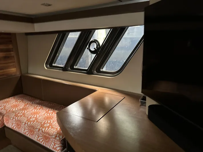  Yacht Photos Pics Interior of 2016 Sea Ray L590 yacht with modern seating and large windows.