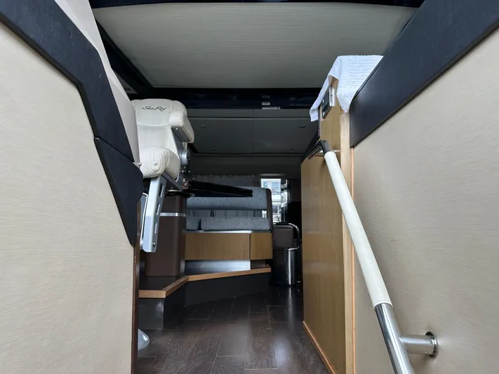  Yacht Photos Pics Interior view of 2016 Sea Ray L590 yacht, featuring modern seating and sleek design elements.