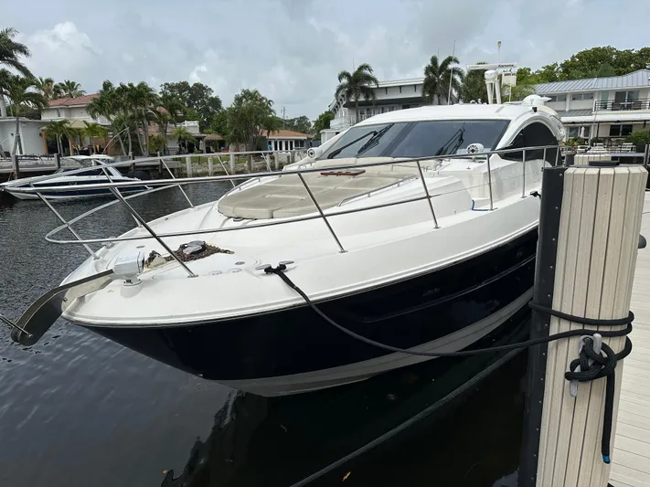  Yacht Photos Pics 2016 Sea Ray L590 yacht docked at a marina, surrounded by palm trees.