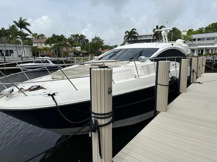  Yacht Photos Pics 2016 Sea Ray L590 yacht docked at marina with palm trees in background.