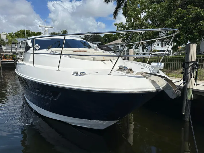  Yacht Photos Pics 2016 Sea Ray L590 yacht docked in a marina, featuring sleek design and luxurious amenities.