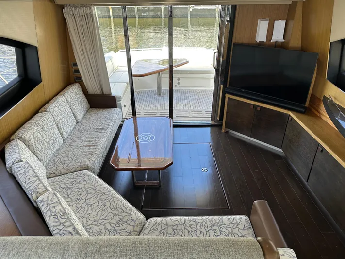  Yacht Photos Pics Luxurious interior of 2016 Sea Ray L590 yacht with elegant seating and large TV.