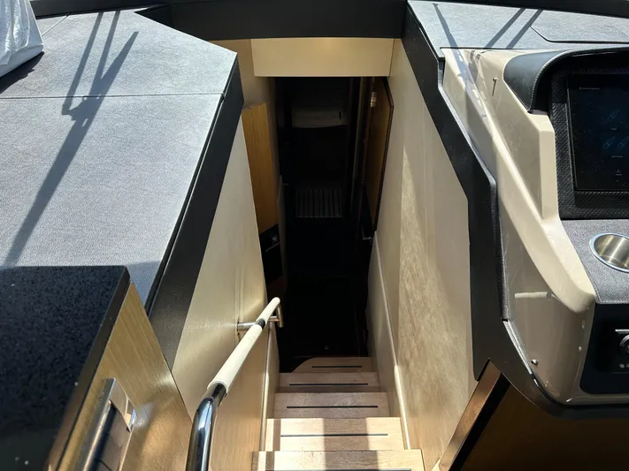  Yacht Photos Pics Interior stairs of 2016 Sea Ray L590 yacht, featuring sleek design and modern materials.