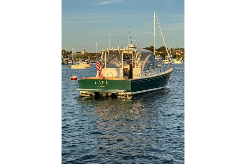 Lark Yacht Photos Pics Little Harbor Whisper Jet 34 boat, 2000 model, anchored in a scenic harbor.