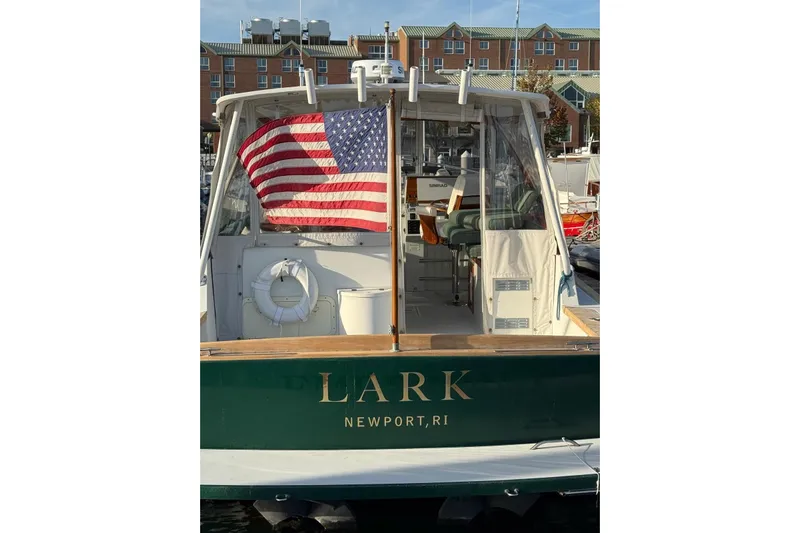 Lark Yacht Photos Pics Little Harbor Whisper Jet 34, 2000 model, docked with American flag, Newport, RI.
