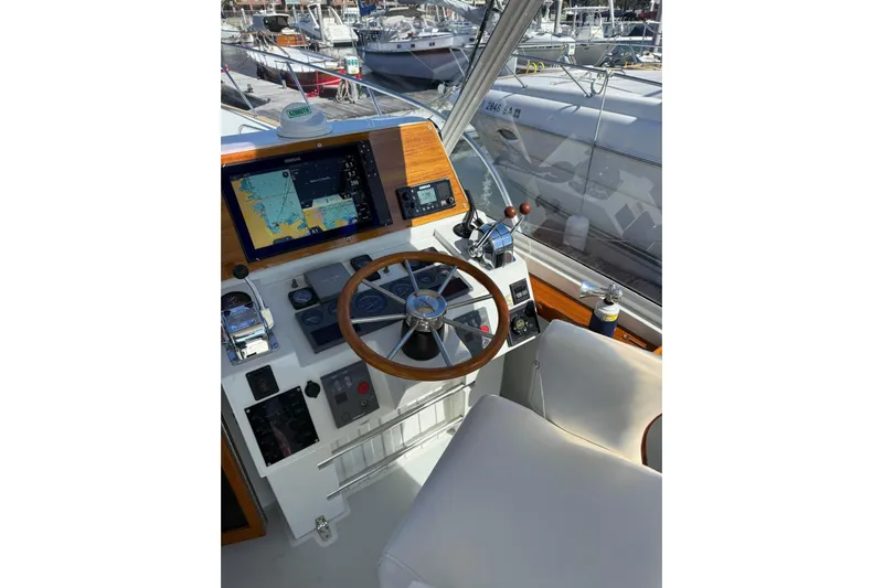 Lark Yacht Photos Pics Helm of 2000 Little Harbor Whisper Jet 34 with navigation equipment and steering wheel.