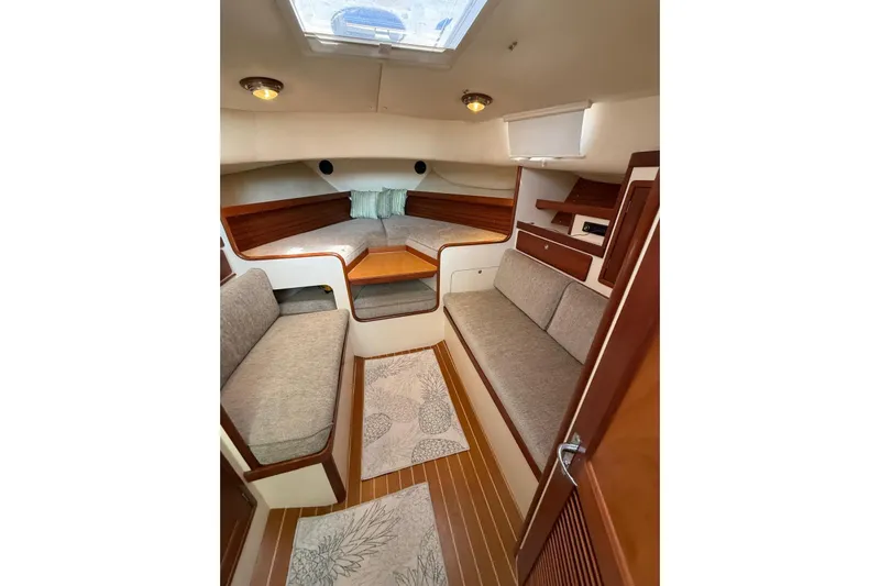 Lark Yacht Photos Pics Interior of 2000 Little Harbor Whisper Jet 34, featuring cozy seating and elegant wood finishes.