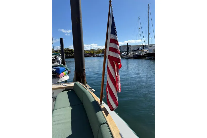 Lark Yacht Photos Pics Little Harbor Whisper Jet 34, 2000 model, docked with American flag, sunny marina view.