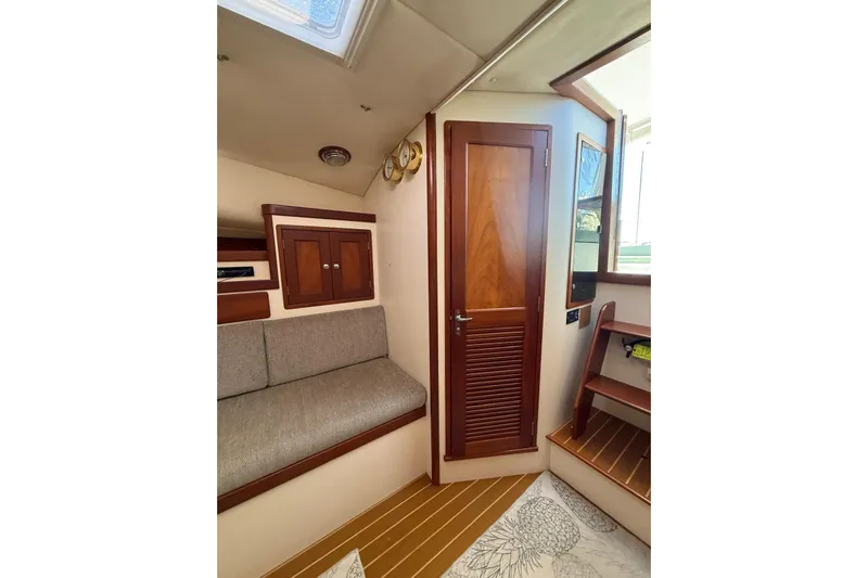 Lark Yacht Photos Pics Interior of 2000 Little Harbor Whisper Jet 34, featuring wooden cabinetry and seating.