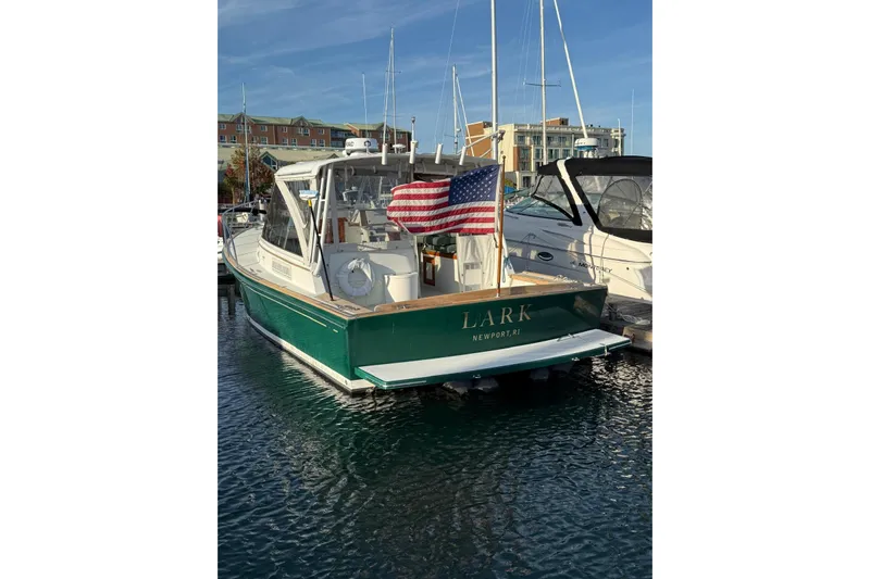Lark Yacht Photos Pics Little Harbor Whisper Jet 34, 2000 model, docked with American flag, Newport, RI.