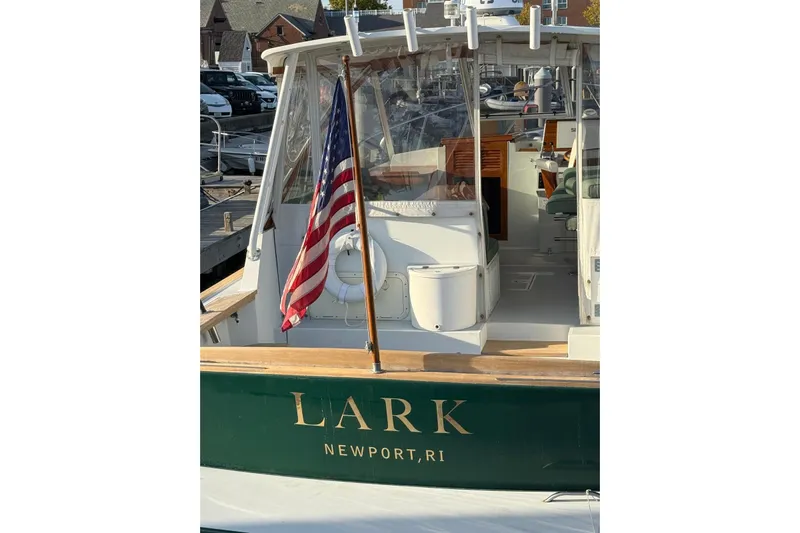 Lark Yacht Photos Pics Little Harbor Whisper Jet 34, 2000 model, docked with American flag, Newport, RI.