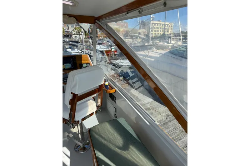 Lark Yacht Photos Pics Interior view of 2000 Little Harbor Whisper Jet 34 boat, featuring helm and seating area.