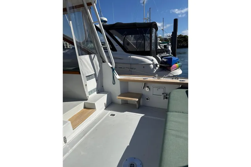 Lark Yacht Photos Pics Little Harbor Whisper Jet 34, 2000 model, docked with visible seating and deck area.