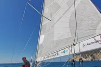 Sailing on a 2003 Solaris 36 yacht with clear blue skies and ocean views.