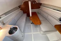 2003 Solaris 36 yacht interior with seating, table, and sink.
