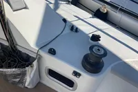Deck of 2003 Solaris 36 sailboat with winch and rope storage.