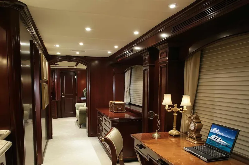 True Love Yacht Photos Pics Luxurious interior of 2003 Trinity Yachts motoryacht with elegant wood furnishings and ambient lighting.