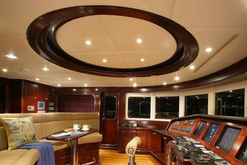 True Love Yacht Photos Pics Luxurious interior of 2003 Trinity Yachts motoryacht with elegant wood finishes and modern controls.