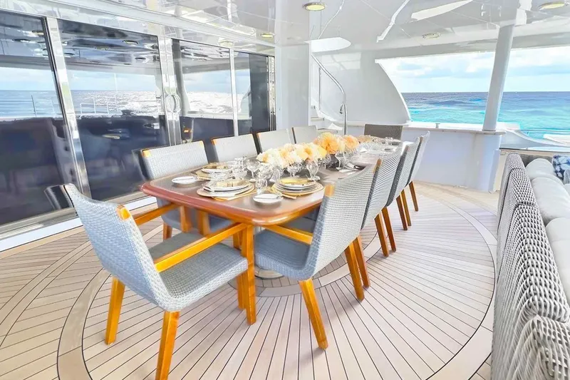 True Love Yacht Photos Pics Luxurious dining area on 2003 Trinity Yachts motoryacht with ocean view.