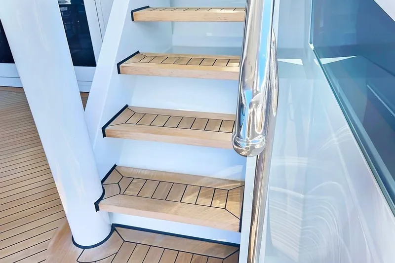 True Love Yacht Photos Pics Staircase on 2003 Trinity Yachts Motoryacht with wooden steps and sleek railing.