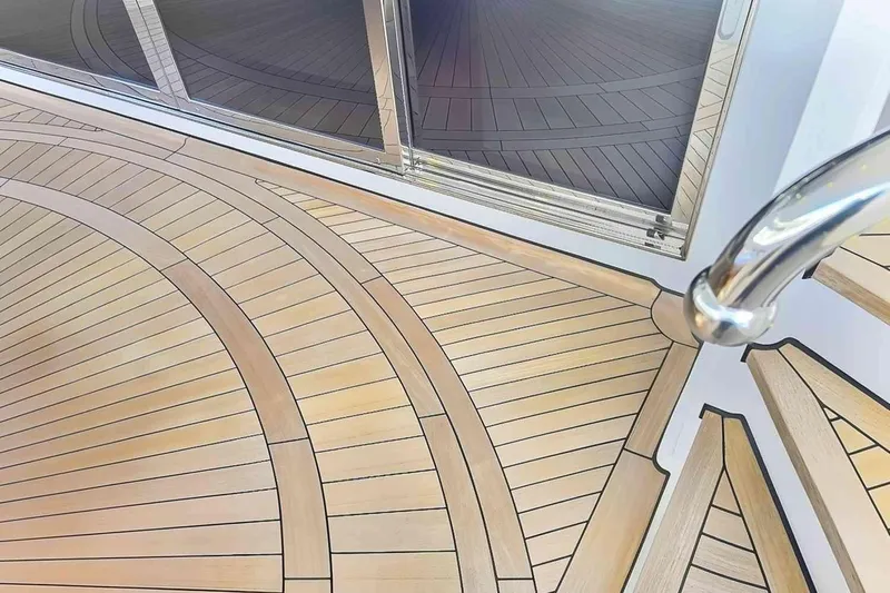 True Love Yacht Photos Pics Luxurious teak deck on 2003 Trinity Yachts Motoryacht with elegant curved design.