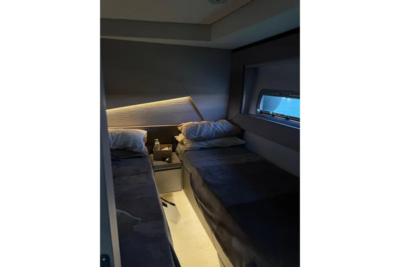  Yacht Photos Pics Luxurious cabin interior of 2021 Pershing 7X yacht with twin beds and modern lighting.