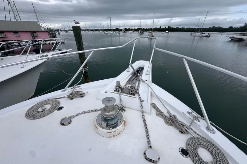  Yacht Photos Pics Bow view of 1979 Hatteras 53 Motor Yacht docked in a marina.