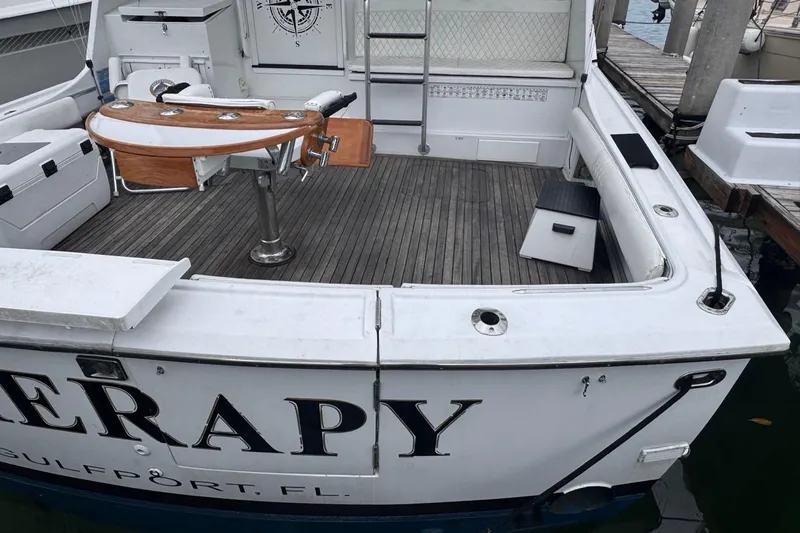  Yacht Photos Pics 1979 Hatteras 53 Motor Yacht stern view with fishing chair and deck in Gulfport, FL.